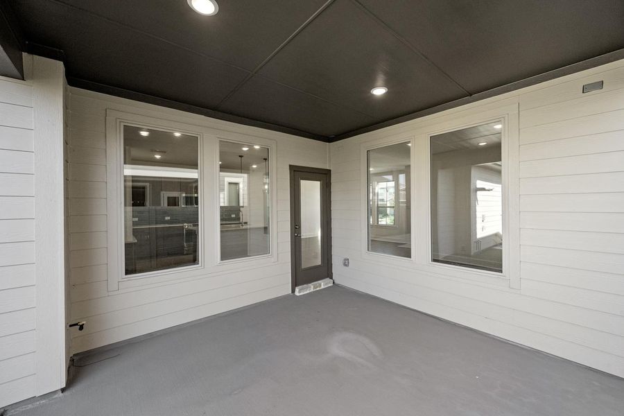 Exterior details and patio area of a home in Terrace Collection at Harvest, Argyle (Image 3).