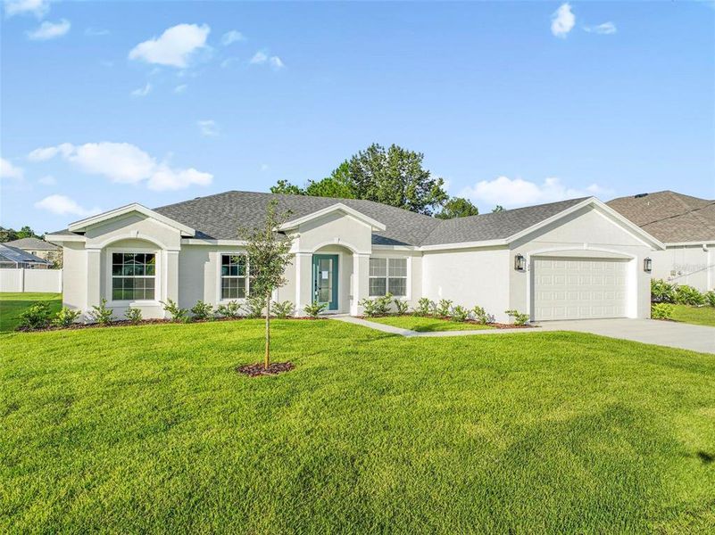 Front exterior of a new home in , Palm Coast, FL, highlighting curb appeal (Image 28).