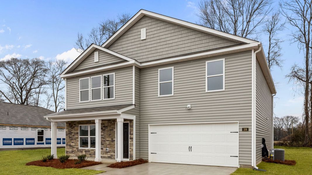 Front exterior of a new home in Blair Ridge, La Grange, NC, highlighting curb appeal (Image 16). Front exterior of a new home in Blair Ridge, La Grange, NC, highlighting curb appeal (Image 16).