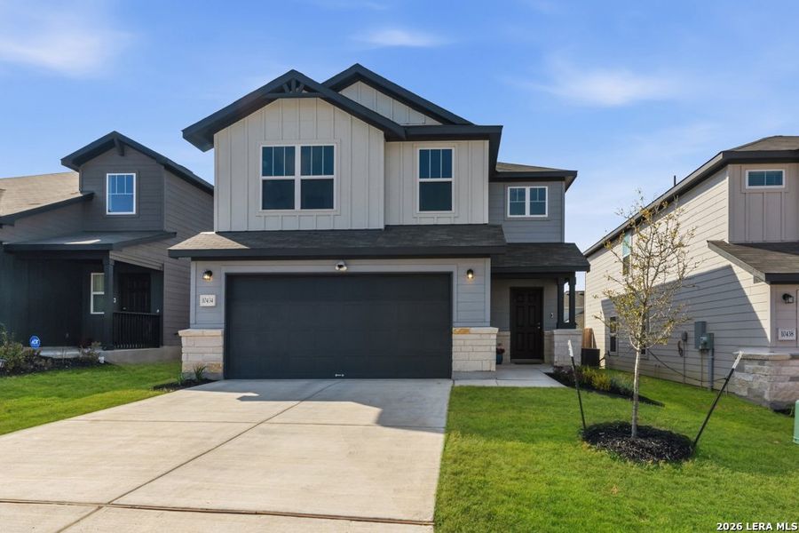 Front exterior of a new home in Cinco Lakes, San Antonio, TX, highlighting curb appeal (Image 2).