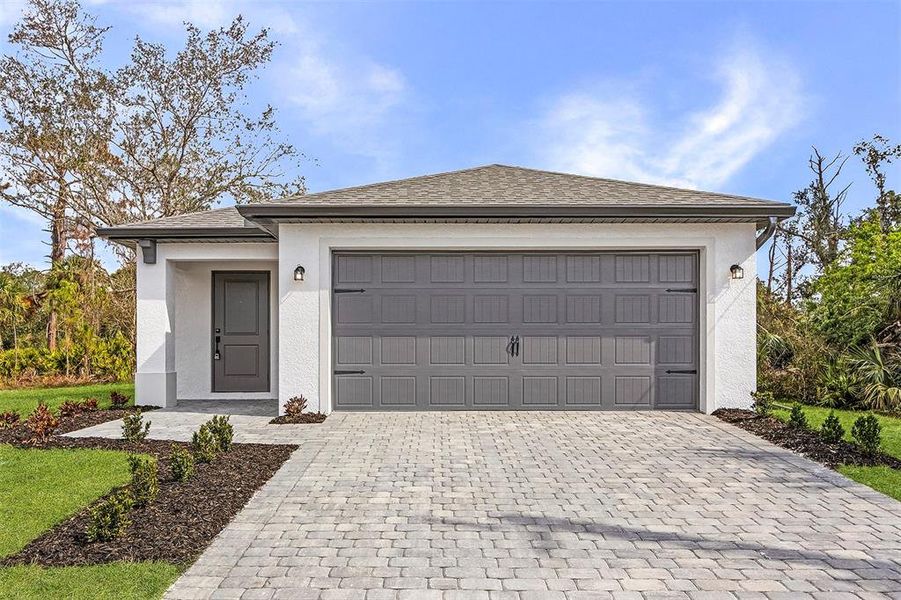 Front exterior of a new home in Port Charlotte, North Port, FL, highlighting curb appeal (Image 1).