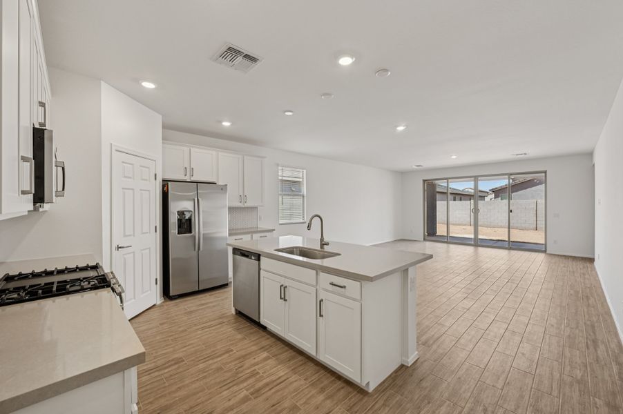 Kitchen and great room. Finishes and options may vary by community