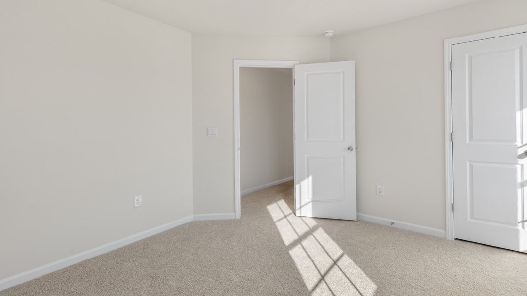 Spacious, unfurnished interior of a new home in The Grove at Matthews Landing, Fuquay Varina (Image 31).