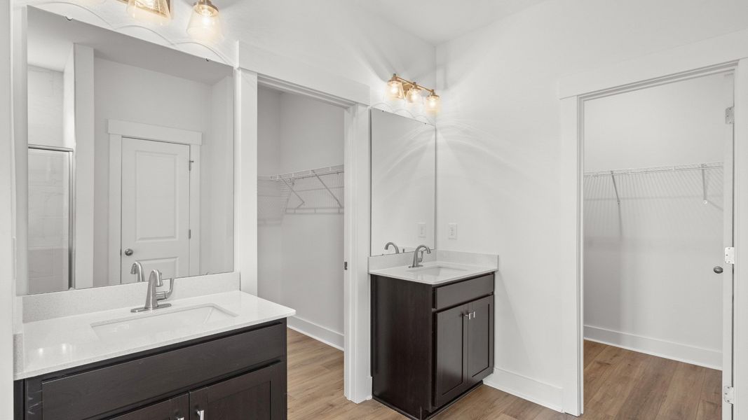 Primary bathroom features dual vanities and sleek modern finishes for everyday comfort. Primary bathroom features dual vanities and sleek modern finishes for everyday comfort.