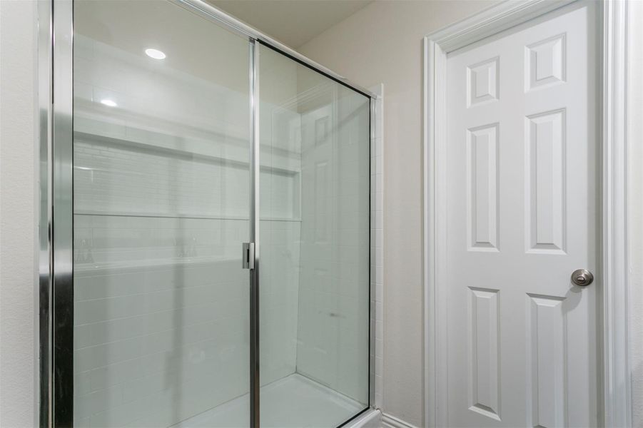 Full bathroom featuring a stall shower Full bathroom featuring a stall shower