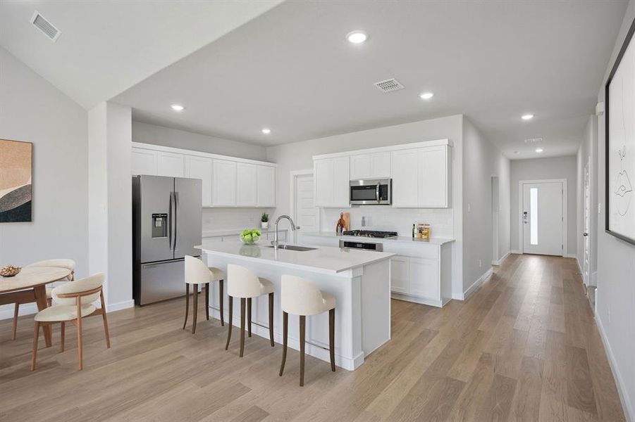 Kitchen in the Masters home plan by Trophy Signature Homes – REPRESENTATIVE PHOTO
