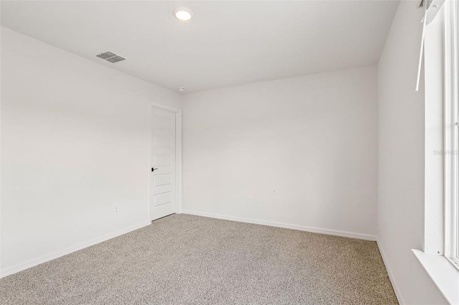 Spacious, unfurnished interior of a new home in The Grove at Stuart Crossing - Signature Series, Bartow (Image 35).