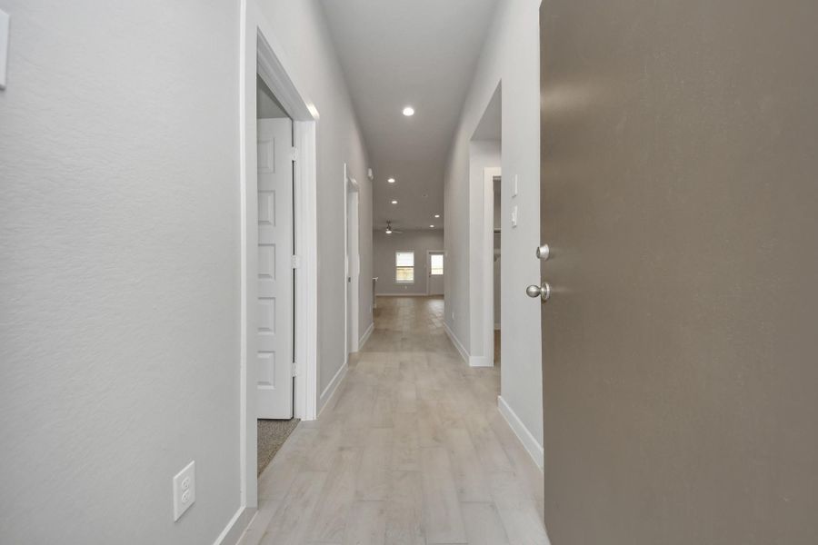 As you step into the threshold of this luxurious home, you&#39;ll soon be welcomed by anelegant glass door (to be installed). Inside, soaring ceilings amplify the spaciousness,while the refined wood-look tile flooring and oversized baseboards exudesophistication and charm. Sample photo of completed home with similar floor plan. Actual colors and selections may vary.