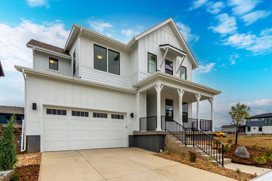 Front exterior of a new home in West Grange, Longmont, CO, highlighting curb appeal (Image 28).