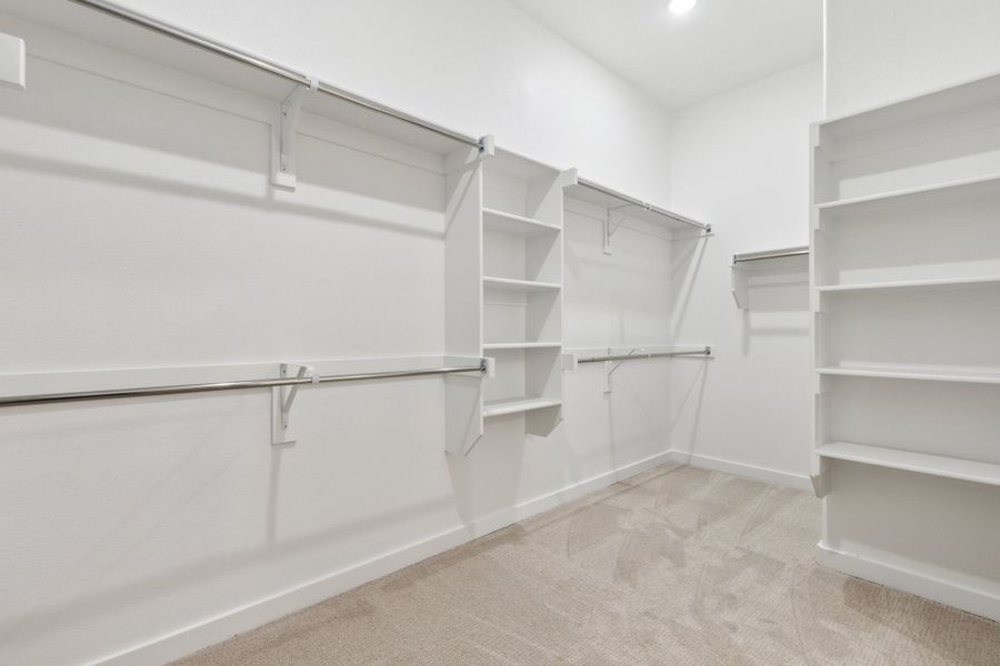 Primary Closet in the Gilmour II home plan by Trophy Signature Homes – REPRESENTATIVE PHOTO