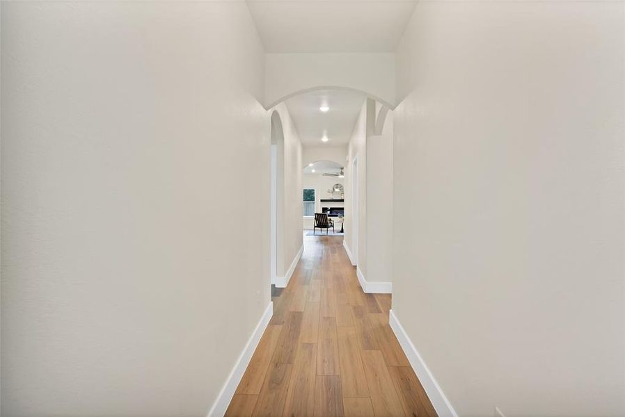 Hall with light hardwood / wood-style flooring