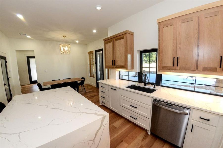 Backsplash windows make it easy to watch the kids out back while cooking.