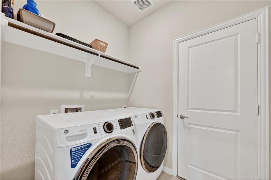 Laundry room with washer and dryer