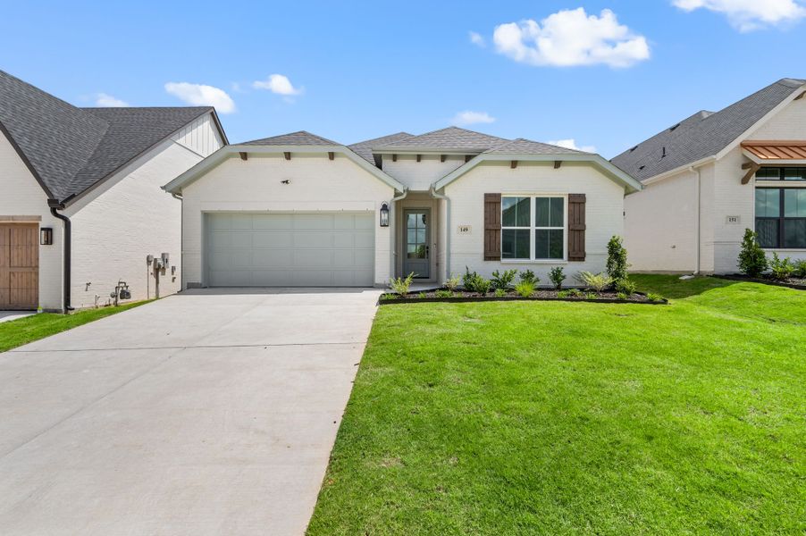 Front exterior of a new home in Parks of Aledo, Aledo, TX, highlighting curb appeal (Image 1). Front exterior of a new home in Parks of Aledo, Aledo, TX, highlighting curb appeal (Image 1).