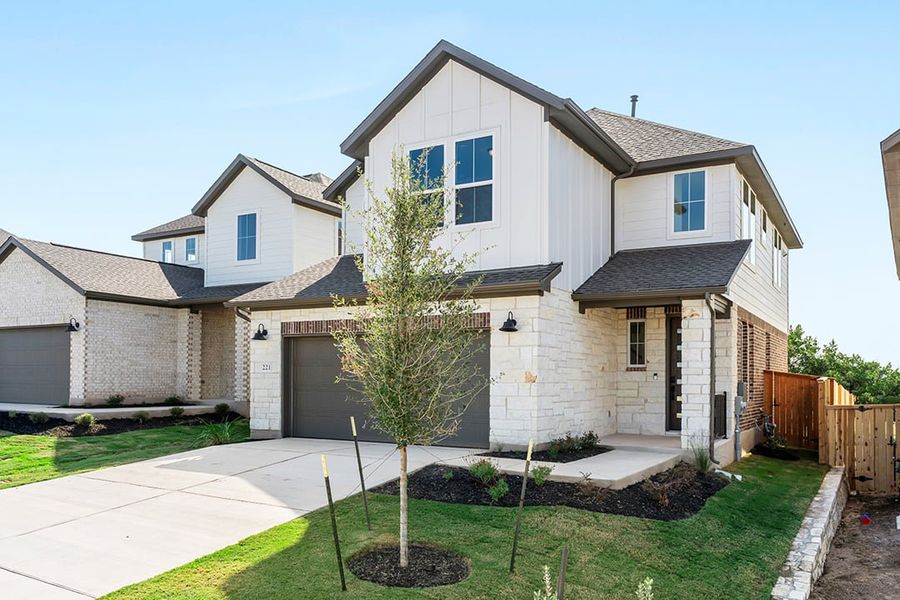 Front exterior of a new home in Terrace Collection at Lariat, Liberty Hill, TX, highlighting curb appeal (Image 22). Front exterior of a new home in Terrace Collection at Lariat, Liberty Hill, TX, highlighting curb appeal (Image 22).
