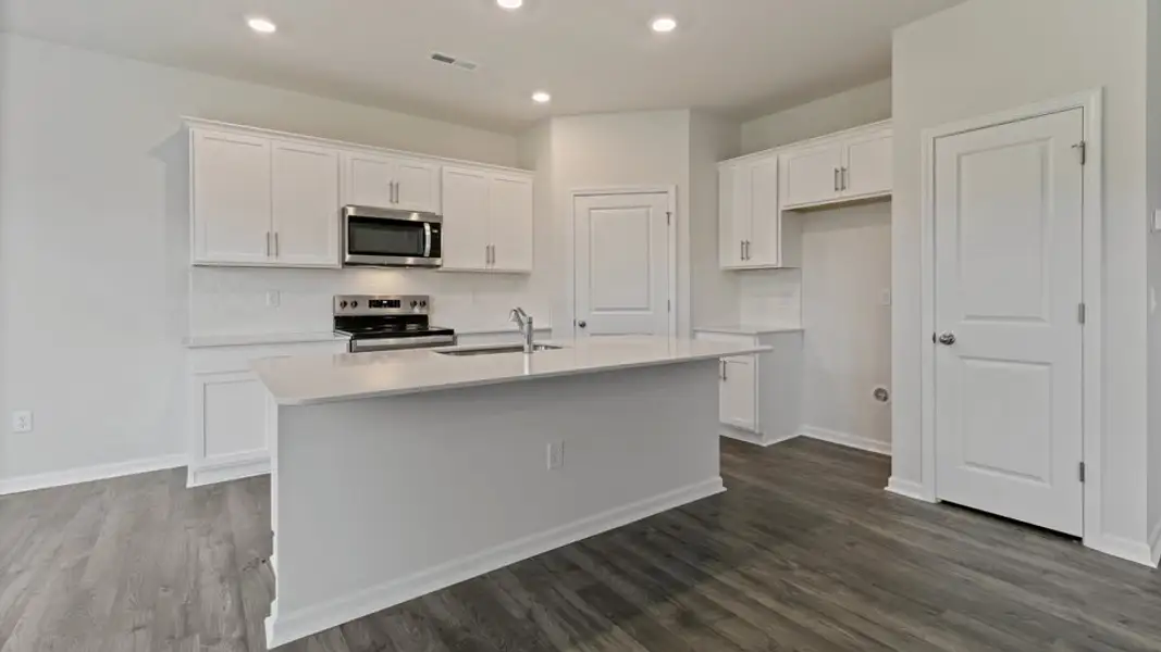 Furnished interior view inside a new home in The Grove at Matthews Landing, Fuquay Varina (Image 4).
