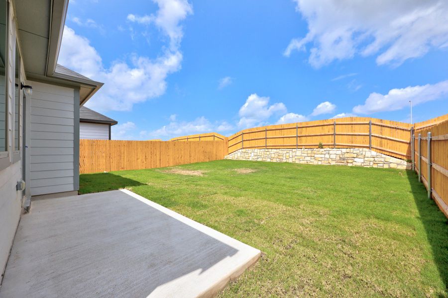 Exterior details and patio area of a home in Trinity Ranch, Elgin (Image 4).