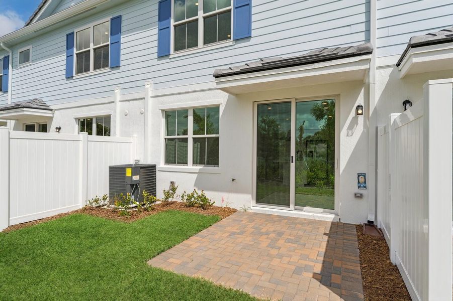 Exterior details and patio area of a home in Salerno Reserve Townhomes, Stuart (Image 2).