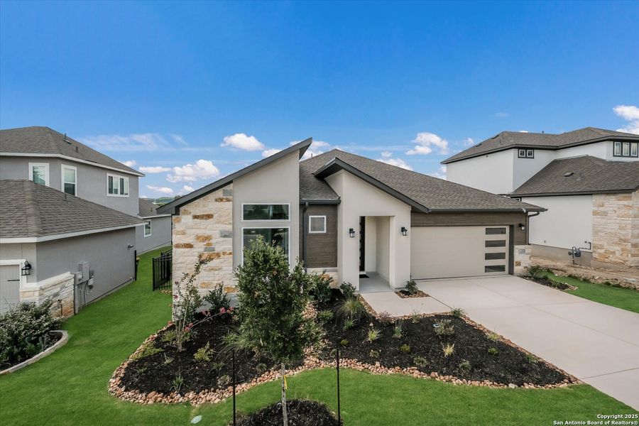 Front exterior of a new home in Esperanza, Boerne, TX, highlighting curb appeal (Image 26).