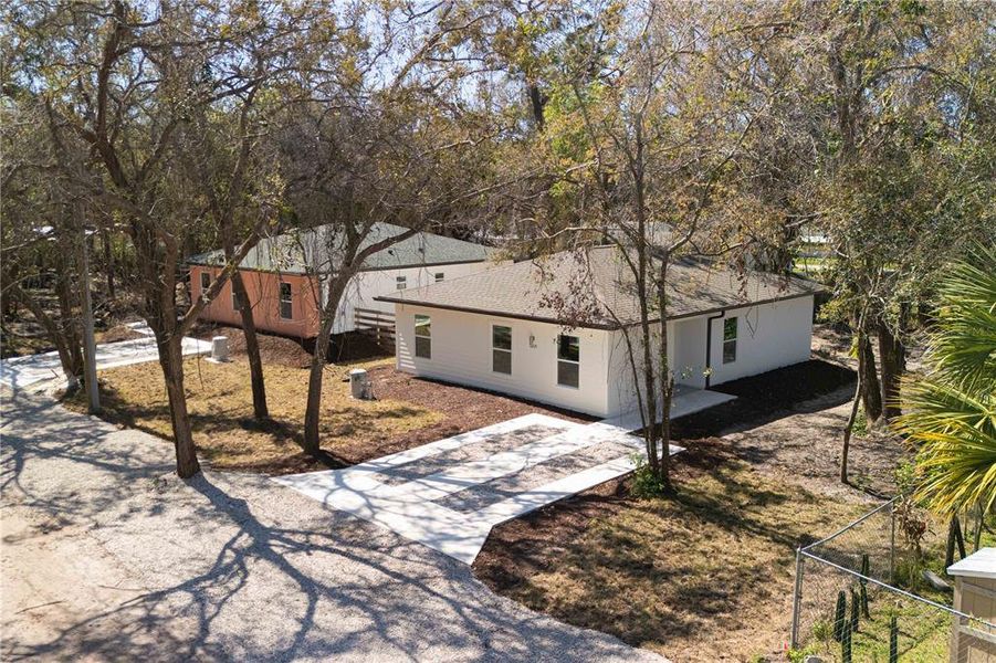 Front exterior of a new home in , New Port Richey, FL, highlighting curb appeal (Image 1).