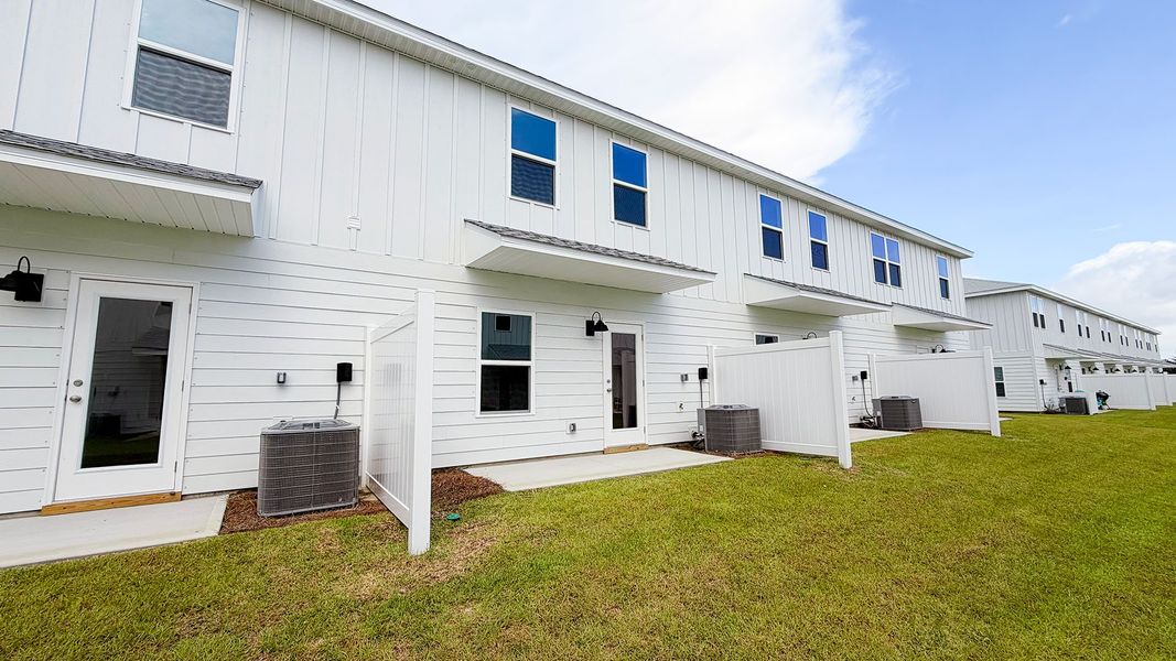 Exterior details and patio area of a home in Salt Creek Townhomes at Mexico Beach, Mexico Beach (Image 4).