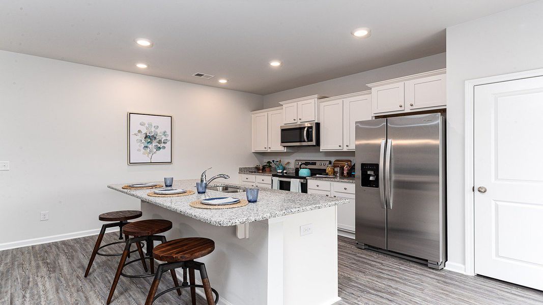 Furnished interior view inside a new home in Stanbury Creek, Supply (Image 5).
