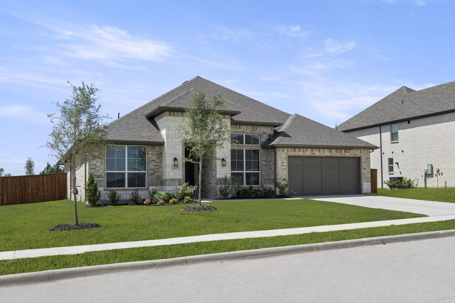 Front exterior of a new home in Lovers Landing, Forney, TX, highlighting curb appeal (Image 2). Front exterior of a new home in Lovers Landing, Forney, TX, highlighting curb appeal (Image 2).