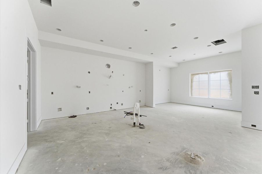 The kitchen opens up to the dining area for family meals.