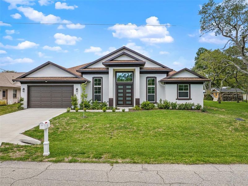 Front exterior of a new home in , Palm Coast, FL, highlighting curb appeal (Image 22). Front exterior of a new home in , Palm Coast, FL, highlighting curb appeal (Image 22).