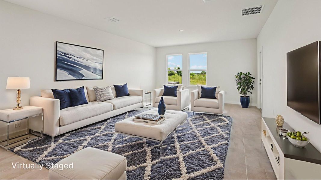 Virtually Staged Living Area of the Jupiter in Hamilton Bluff located in Haines City, FL.
