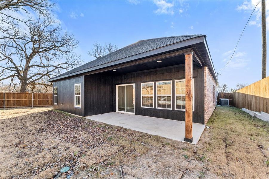 Back of property featuring a patio and central air condition unit