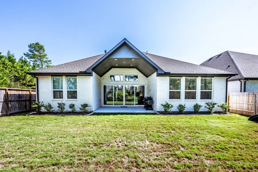 Exterior details and patio area of a home in , Conroe (Image 26).