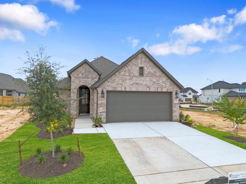 Front exterior of a new home in Jubilee 40', Hockley, TX, highlighting curb appeal (Image 22). Front exterior of a new home in Jubilee 40', Hockley, TX, highlighting curb appeal (Image 22).