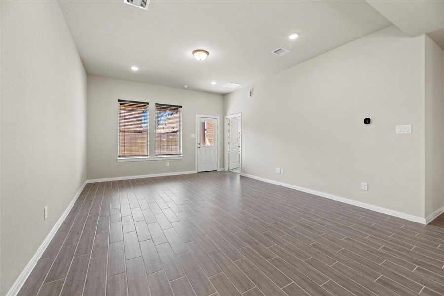 Custom blinds throughout the home allow for natural light and privacy.
