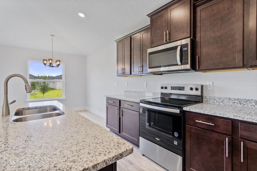 Furnished interior view inside a new home in Shadow Crest at Rolling Hills, Green Cove Springs (Image 9).