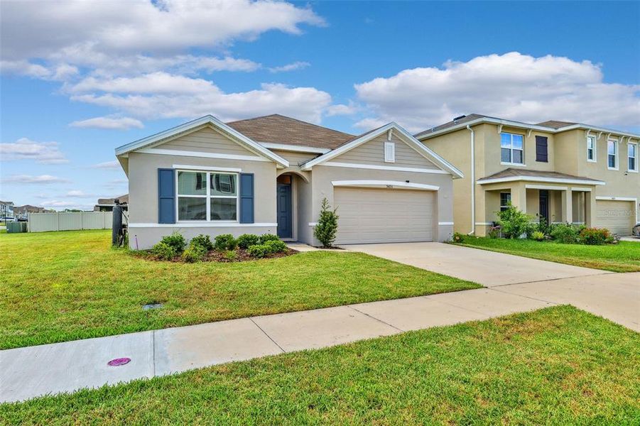 Front exterior of a new home in , Wesley Chapel, FL, highlighting curb appeal (Image 25).