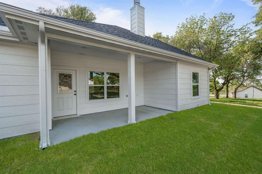 Front exterior of a new home in , Poolville, TX, highlighting curb appeal (Image 17).
