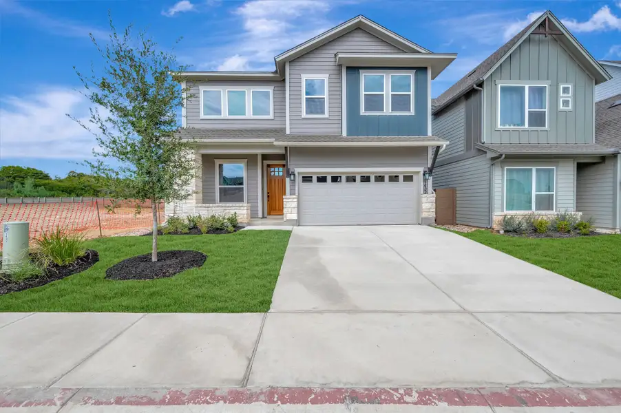 Front exterior of a new home in Double Creek Crossing, Round Rock, TX, highlighting curb appeal (Image 1). Front exterior of a new home in Double Creek Crossing, Round Rock, TX, highlighting curb appeal (Image 1).
