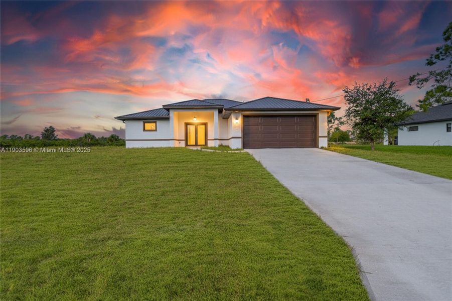 Front exterior of a new home in , Lehigh Acres, FL, highlighting curb appeal (Image 21).