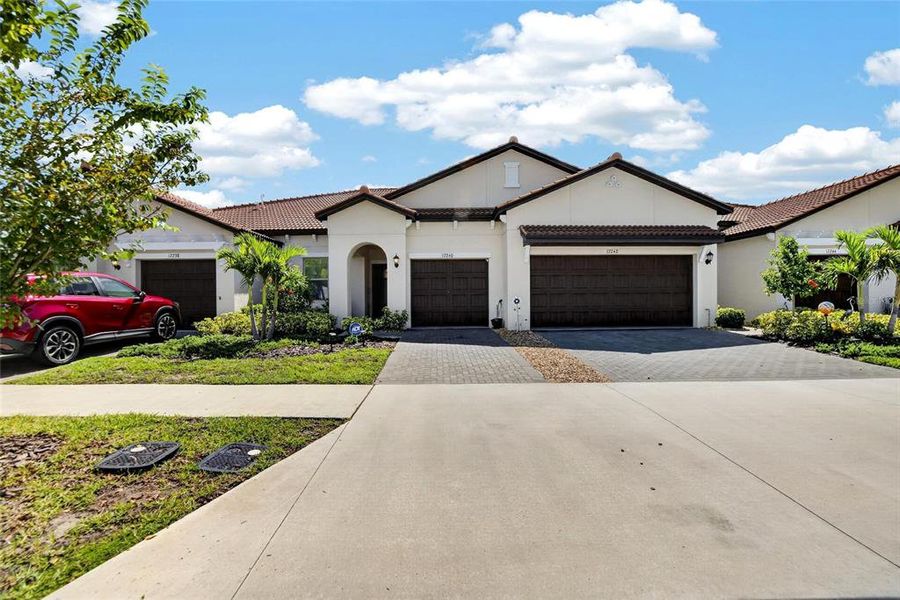 Front exterior of a new home in Southshore Bay Active Adult, Wimauma, FL, highlighting curb appeal (Image 32).