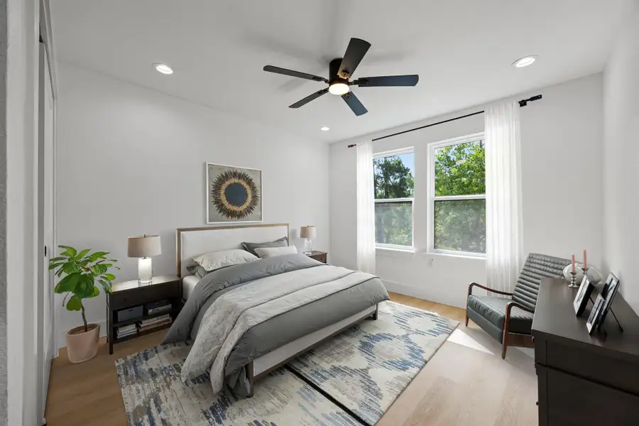 Virtually staged Bedroom featuring light wood-type flooring, ceiling fan, and recessed lighting Virtually staged Bedroom featuring light wood-type flooring, ceiling fan, and recessed lighting
