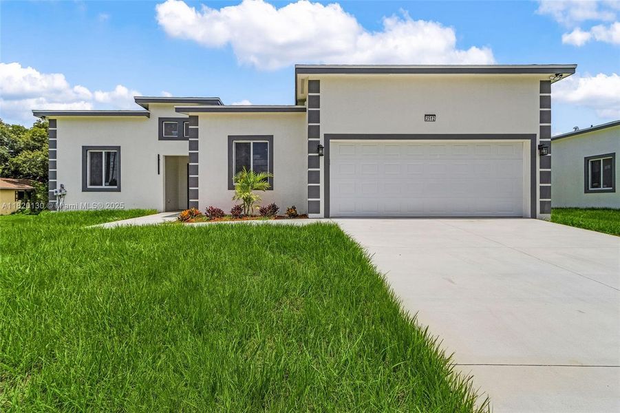 Front exterior of a new home in , Lehigh Acres, FL, highlighting curb appeal (Image 18).