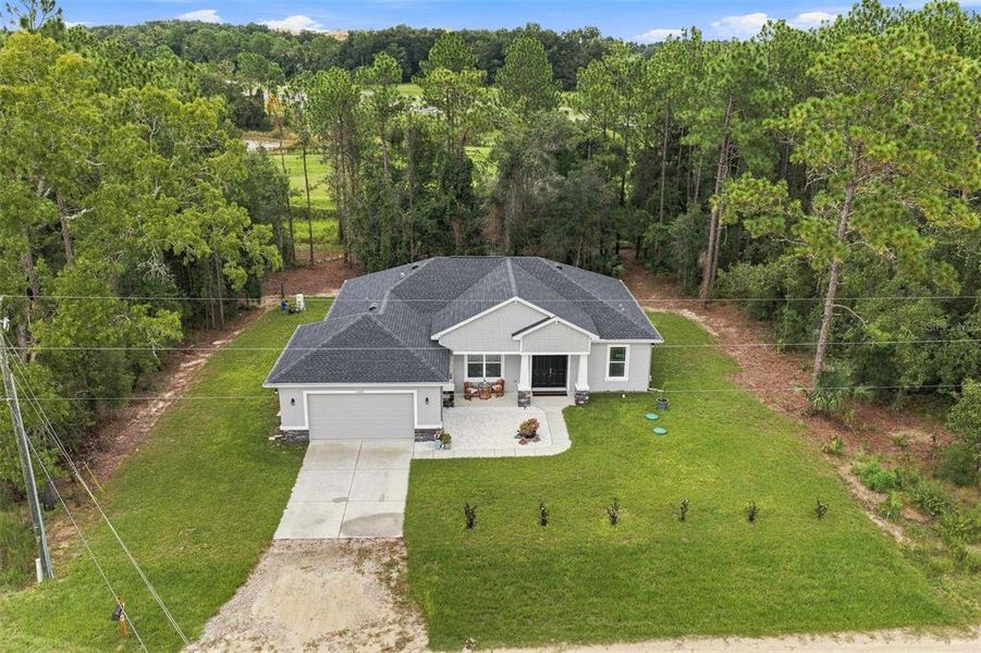 Front exterior of a new home in , Weeki Wachee, FL, highlighting curb appeal (Image 22). Front exterior of a new home in , Weeki Wachee, FL, highlighting curb appeal (Image 22).