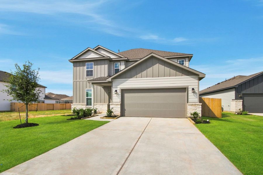 Front exterior of a new home in Caney Mills, Conroe, TX, highlighting curb appeal (Image 2). Front exterior of a new home in Caney Mills, Conroe, TX, highlighting curb appeal (Image 2).