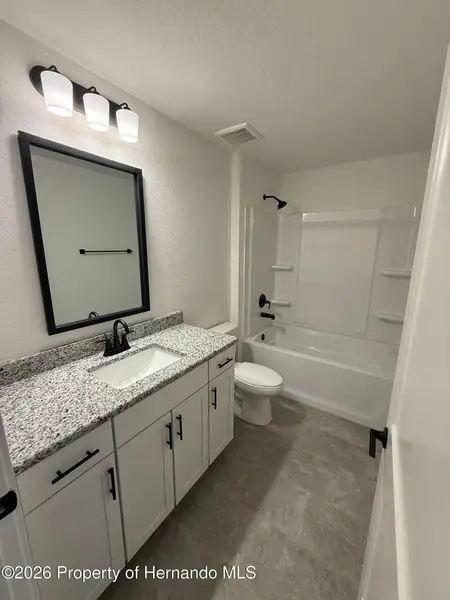 Furnished interior view inside a new home in Winding Oaks, Weeki Wachee (Image 4).
