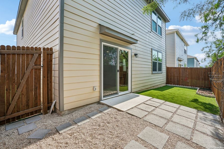 Exterior details and patio area of a home in University Village, San Antonio (Image 28).