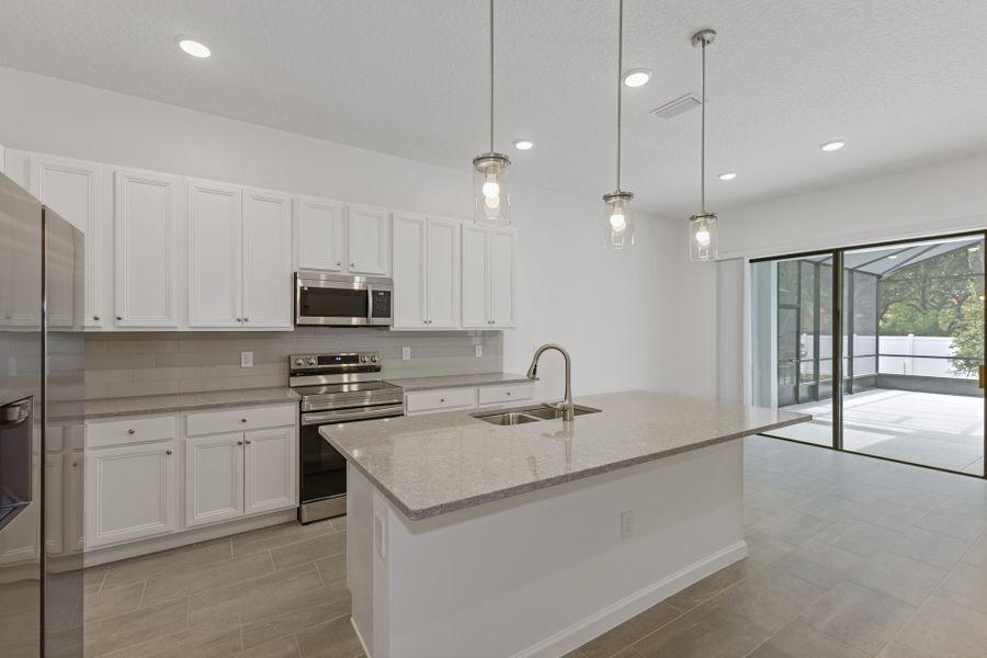 Representative furnished interior of a home built from the Aquamarine by Park Square Residential in Paradiso Grande, Orlando (Image 6).