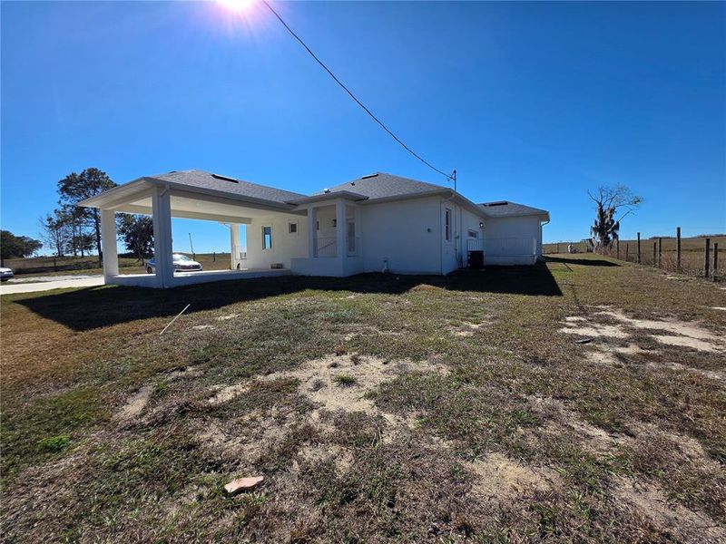 Exterior details and patio area of a home in , Polk City (Image 16).
