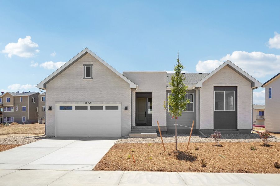 Front exterior of a new home in The Aurora Highlands, Aurora, CO, highlighting curb appeal (Image 1). Front exterior of a new home in The Aurora Highlands, Aurora, CO, highlighting curb appeal (Image 1).