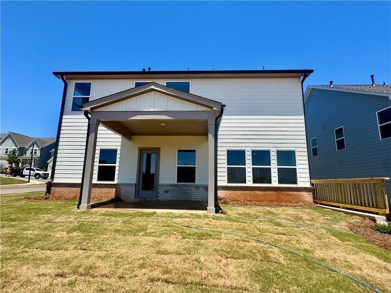 Exterior details and patio area of a home in Eastlyn Crossing, Flowery Branch (Image 18).
